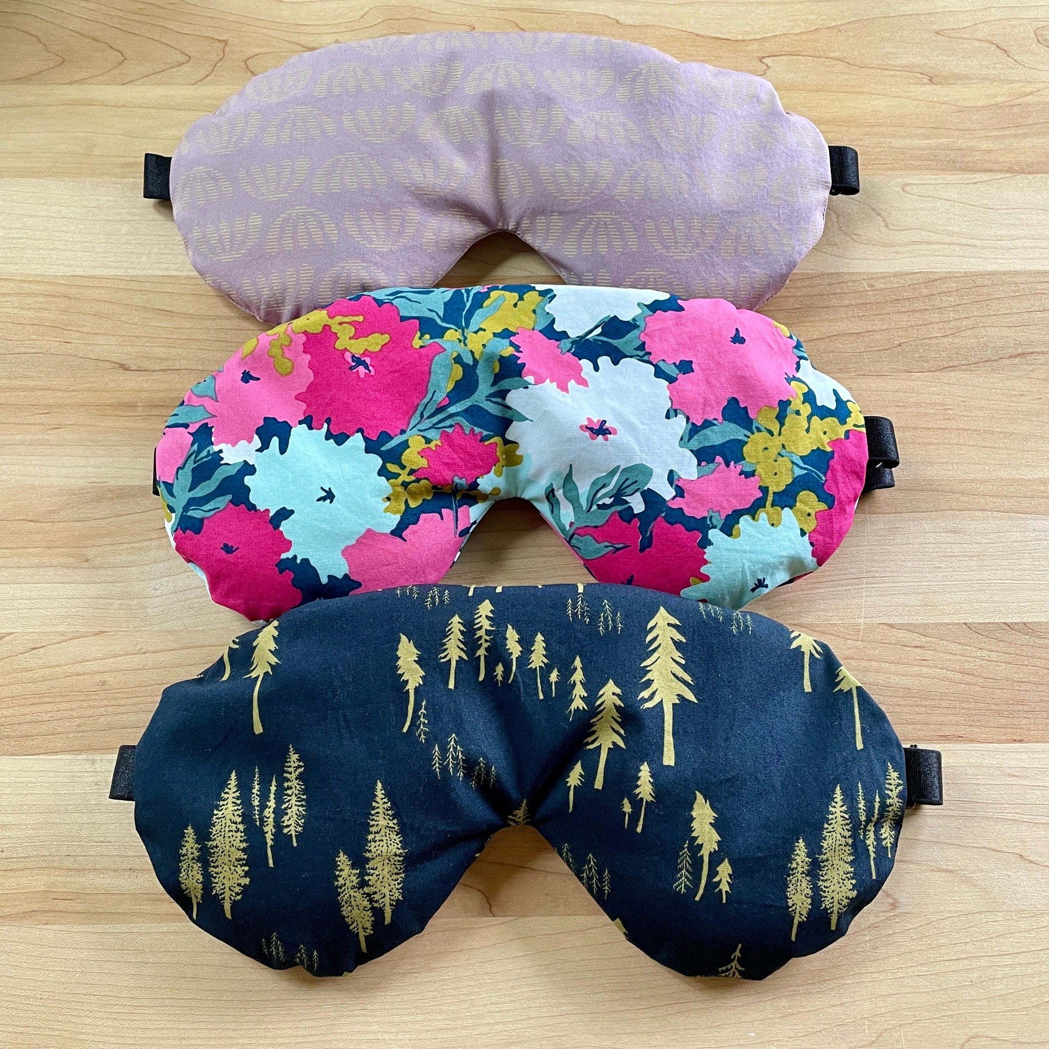 Eye mask, lavender fabric with fan pattern, floral print, and navy tree print