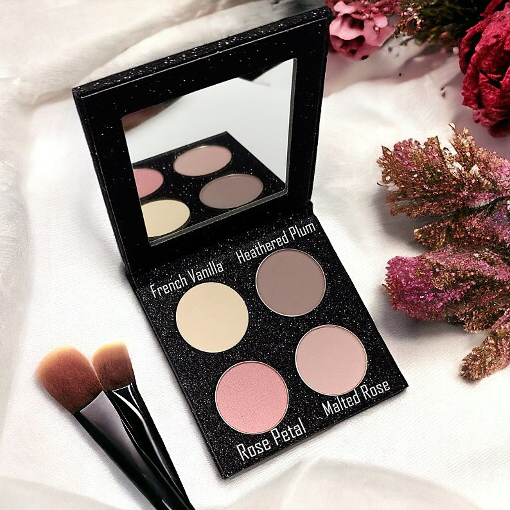 Square rose gold palette with four vanilla and rose-toned eyeshadows in matte and shimmer finishes