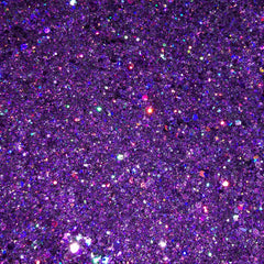 Close-up of holographic amethyst eyeshadow with deep purple shimmer and iridescent sparkle