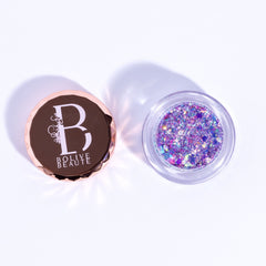 Glitter eyeshadow with iridescent purple and lavender colors in a clear jar, Bolive Beaute brand visible