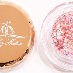 Glitter eyeshadow in pink and iridescent, with a gold lid, By Melissa branding visible