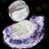 Shimmering iridescent loose pigment in white, purple, and ultraviolet hues with reflective sparkle