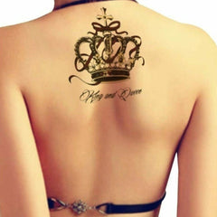 Temporary tattoo of a crown with "King and Queen" text, black and gold design on skin