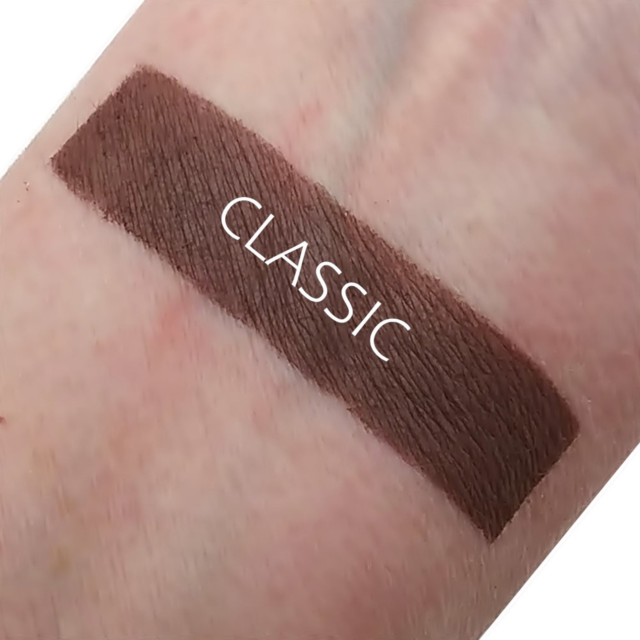 Single matte eyeshadow pan in a classic neutral shade with smooth powder finish, shown in square compact.