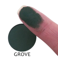 Close-up of matte eyeshadow pan showing smooth powder texture in rich, pigmented color