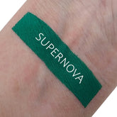 Front view of Matte Supernova Eyeshadow in a sleek black compact with color swatch showing rich pigment texture