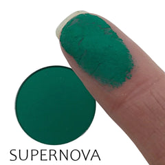 Close-up of matte Supernova eyeshadow pan showing smooth, velvety texture in rich pigment.