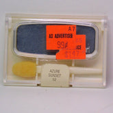 Close-up of Cover Girl Pro Vintage Eye Shadow compact in shimmering azure blue and sunset orange hues with silver detailing