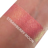 Close-up of Chrome Shifting Strawberry Moon eyeshadow pot showing pink metallic shimmer with reflective finish