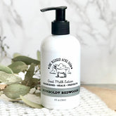 Goat milk lotion bottle with black pump, white label, and One Blessed Acre Farm text