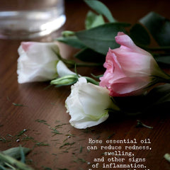 Hand scooping whipped rose body butter from jar, showing rich creamy texture with shea and coconut oil