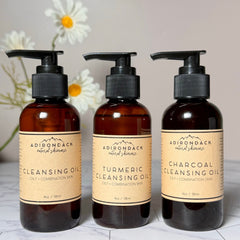 Oily skin cleanser bottles with black pump tops and brown glass, Adirondack Natural Skincare label