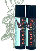 Lip balm tubes with black caps, Anatomy Naturals brand, and a mint leaf design on white background.