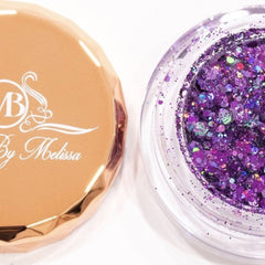 Side view of deep purple holographic amethyst eyeshadow pan catching light with iridescent shimmer