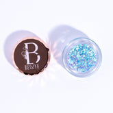 Close-up of celestial sky blue glitter eyeshadow in compact with reflective shimmer particles