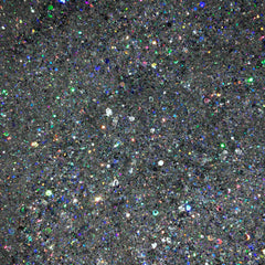 Close-up of holographic silver glitter eyeshadow with intense metallic sheen and reflective particles