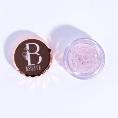 Pigmented iridescent pink glitter eyeshadow in compact with reflective fairy dust finish