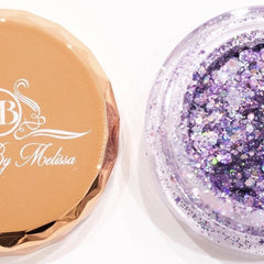Side angle of holographic lavender glitter eyeshadow pot catching light, showing iridescent shift