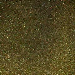 Glitter background with gold, green, and multicolored flecks, sparkly texture