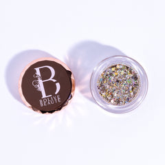Eye shadow glitter in clear jar, multi-color shimmer, and Bolive BEAUT logo on lid