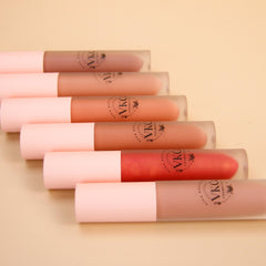 Lipstick tubes with pink caps, various shades, and VKC Cosmetics logo