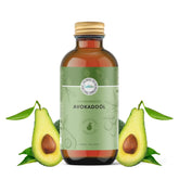 Avocado oil bottle with brown glass, gold cap, and Lebbio label, with avocado halves and leaves