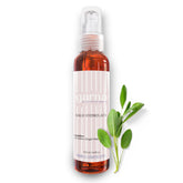 Sage hydrosol spray bottle, clear pump, amber liquid, and Garna label with sage leaves