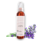 Toner spray bottle with brown liquid, white label, and purple lavender flowers