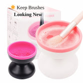 Makeup brush cleaner with pink, white, and black components, used for cleaning a makeup brush