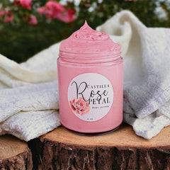 Close-up of whipped rose body butter with visible airy texture in a white jar, showcasing shea and coconut oil swirls
