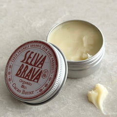 Cacao butter in silver tin, with cream-colored balm and Seiva Brava label visible