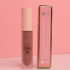 Lipstick tube with pink and brown color, VKC Cosmetics brand visible, with matching box beside it