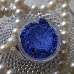 Close-up of vibrant blue sapphire matte eyeshadow pan with smooth, velvety texture and rich pigment payoff