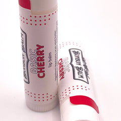 Lip balm tubes with red and white polka dot pattern, Bonbon Balm Basic Cherry label on white background