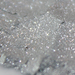 Silver glitter material with sparkling highlights and bokeh effect background