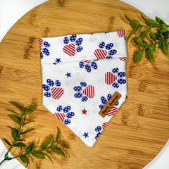 Front view of Classic Americano Paws dog bandana tie with brown coffee-themed print and adjustable neck strap