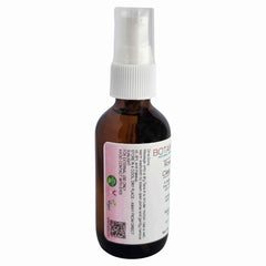 Facial cleanser bottle, brown glass, white pump, with label and text