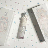 Glitter Liquid Eyeshadow with unicorn top, clear tube, and "Cute Rumor" box