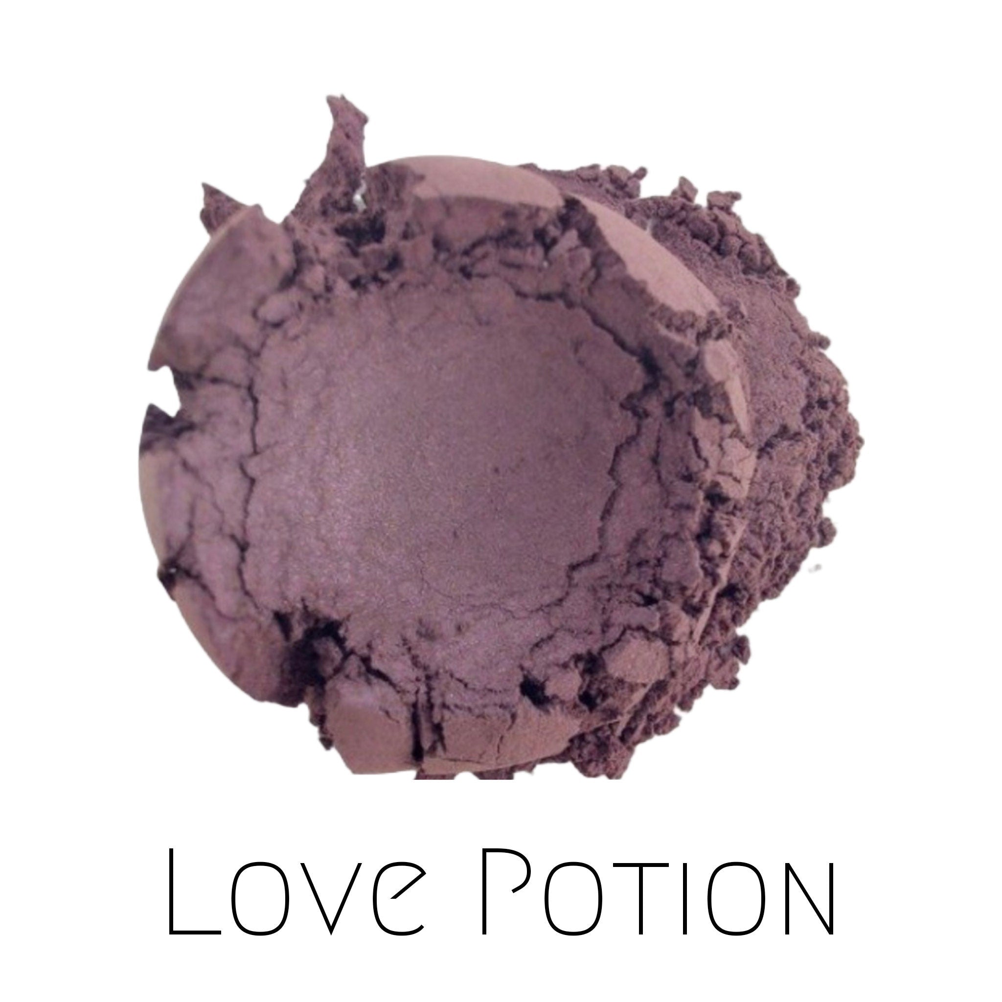 Close-up of Vegan Mineral Eyeshadow in Love Potion - a shimmering purple powder with eco-friendly packaging
