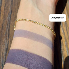 Close-up of vegan purple shimmer eyeshadow with mineral sparkle in compact pan