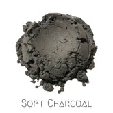 Vegan mineral eyeshadow pot in soft charcoal grey-black with semi-matte finish and eco-friendly packaging