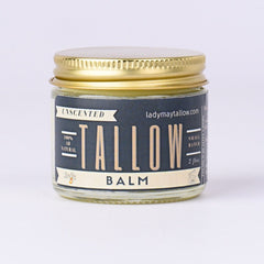 Tallow balm jar with gold lid and label, Lady May's brand visible, on white background