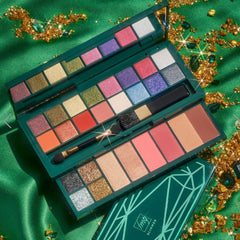 Eyeshadow palette with multiple colors, green case, and makeup brushes, "fmGlimmer" text visible