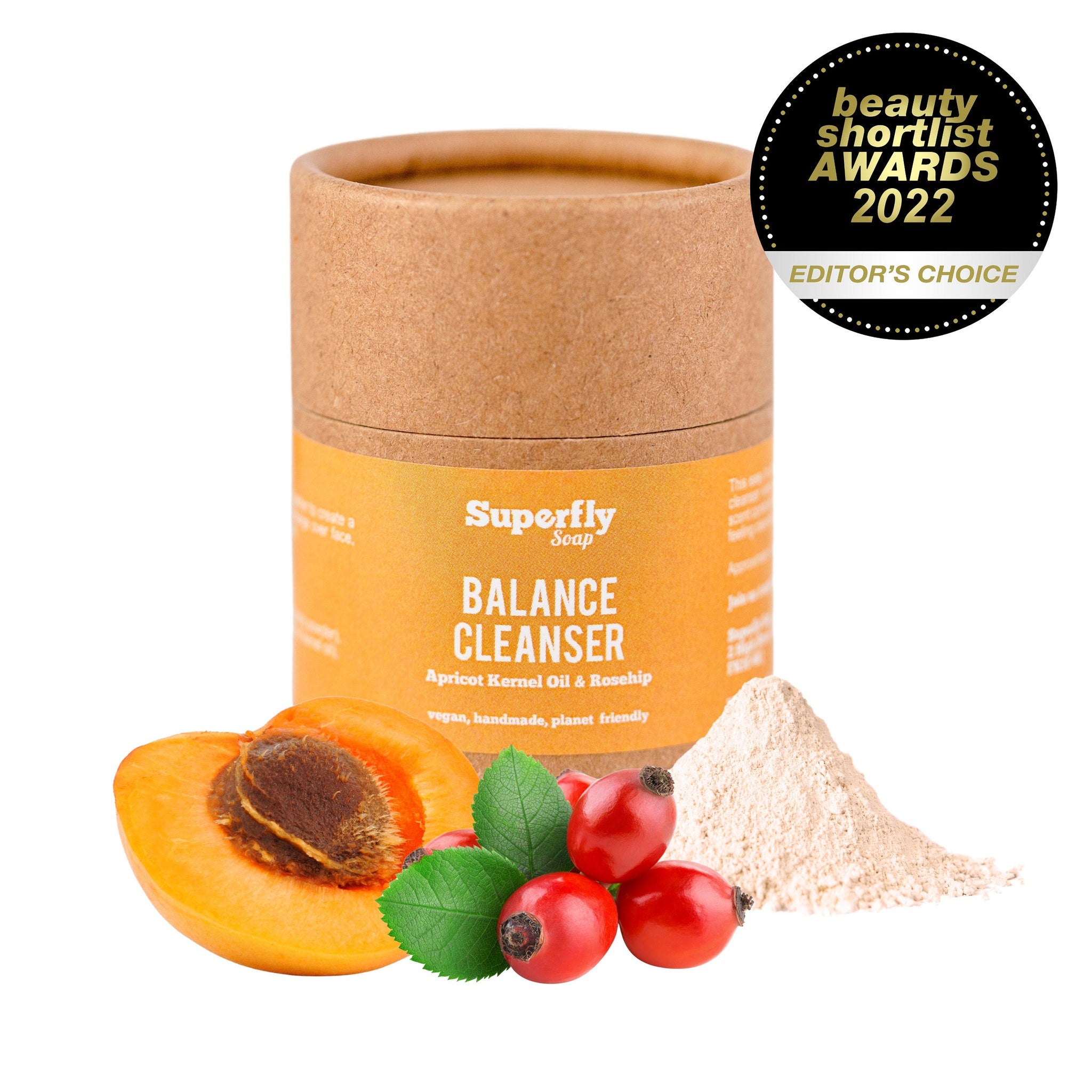Facial cleanser with brown cardboard tube, orange label, and fruit and powder elements
