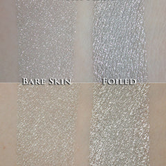 Silver eyeshadow swatches with glittery and foiled textures, shown on skin