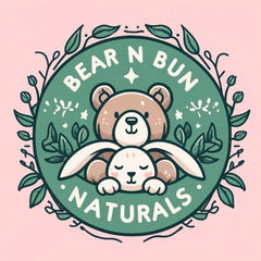 Bear and bunny logo with green and pink color scheme, surrounded by leaves, Bear N Bun Naturals text