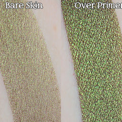 Glitter eyeshadow swatch, metallic green and gold with crosshatch pattern, over bare skin and primer
