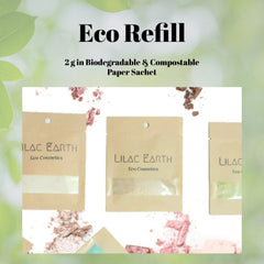 Close-up of fingertips applying shimmery deep aubergine eyeshadow to eyelid with smoky indigo blended in crease