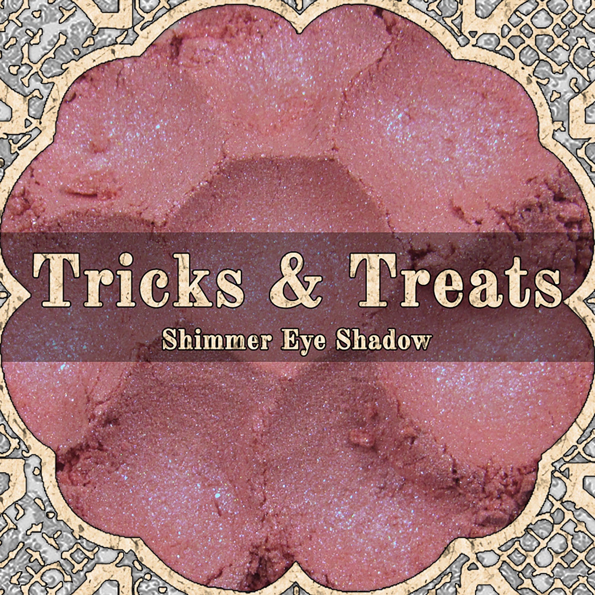 Light cerise pink loose powder eyeshadow with blue duochrome shimmer in open jar