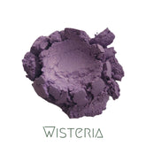 Close-up of vegan purple shimmer eyeshadow in compact with wisteria hue and mineral finish